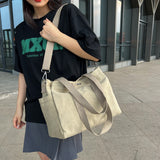 卡其色帆布休閒簡約前後磁扣口袋大容量中性款多用途拉鍊側背包
