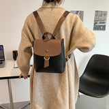 黑色彷皮簡約復古金屬環帶子綴飾翻蓋設計雙隔層後背包