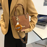 棕色彷皮拼絨面色彩圖案肩帶金屬細節手提斜背包 (附眼鏡公仔毛球吊飾)