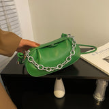 綠色彷皮圓滑荷包形頂部磁扣設計金屬鏈條手提斜背包