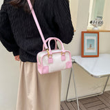 粉色仿皮復古風格小型行李包設計可愛手提斜背包