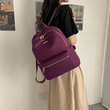 紫色尼龍多拉鍊口袋實用結構百搭耐用防水中性款後背包