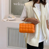 橙色彷皮編織款式金屬鏈條肩帶設計柔軟質感翻蓋斜背包